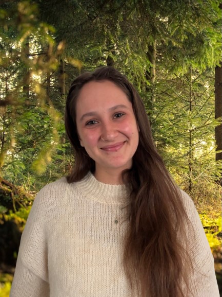 A student wearing a sweater